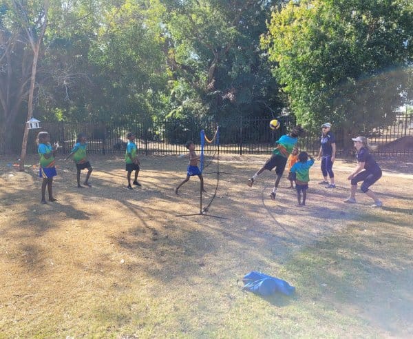 Children playing volleyball outside