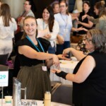 A group of people playing a game at a conference